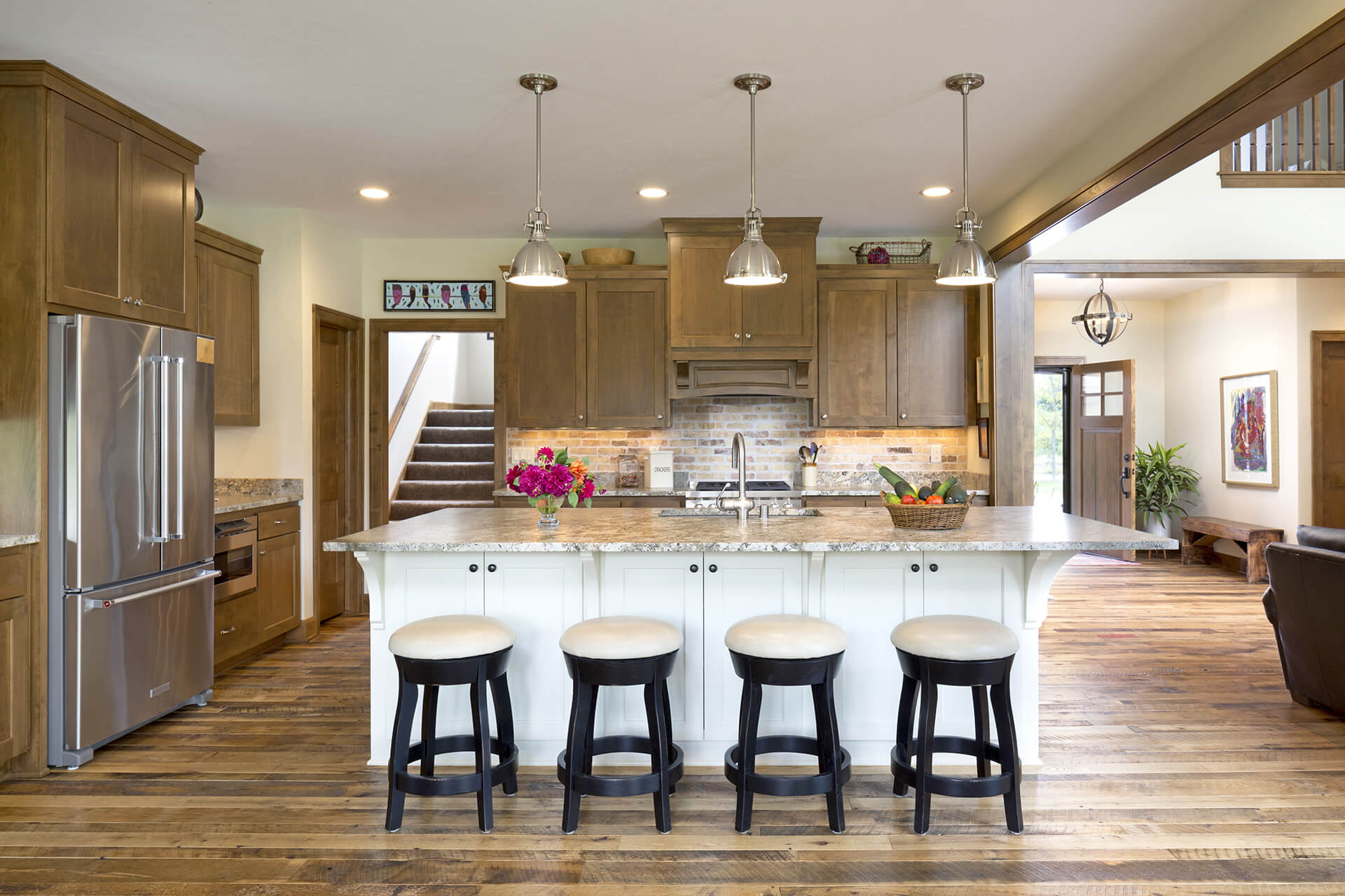 Genesee Lake Farmhouse kitchen and barstool seating area